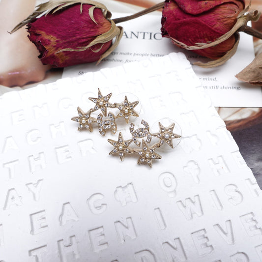 Pre-Owned Chanel Gold 3 Star Crystal Piercing Earrings