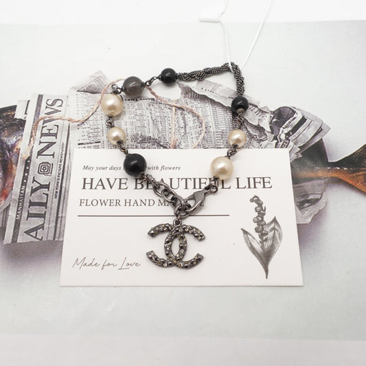 Pre-Owned Chanel Gold Tone CC Pearl&Diamond Black&White Bracelet