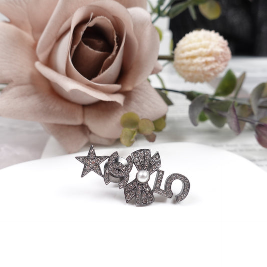 Pre-Owned Chanel Black Metal Crystal Brooch