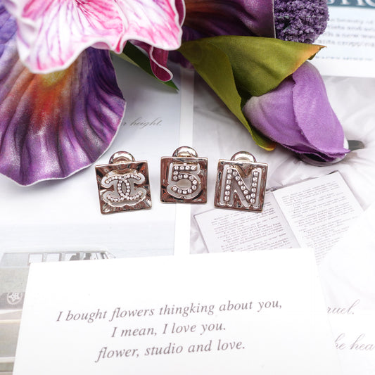 Pre-Owned Gold Chanel Crystal No.5 CC Earrings